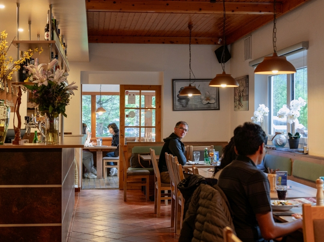 Wood-lined dining interior at Pizzeria Kegelbahn